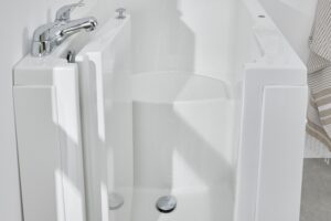 Florida walk in compact bath with seat and door open detail