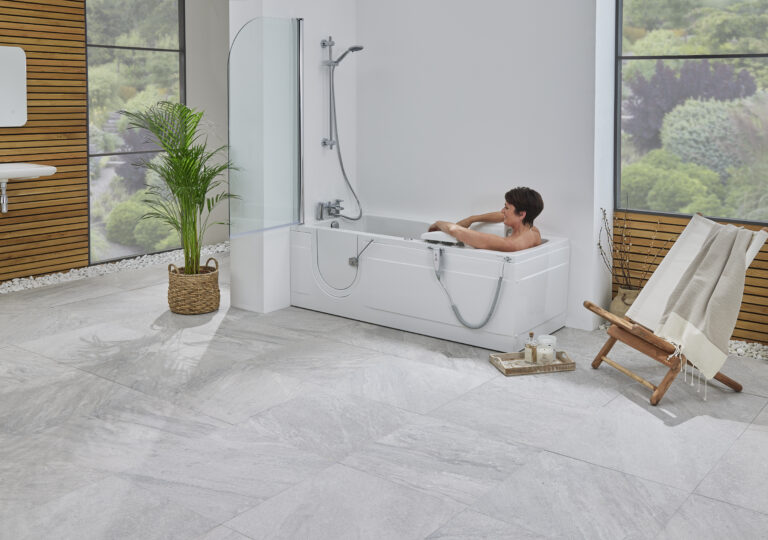 Montana Bathroom with White Bathtub, Marble Tiles & Natural Light